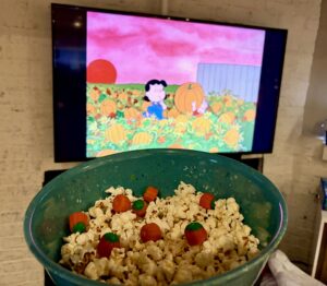 Pumpkin Patch popcorn with cinnamon sugar and candy pumpkins for It’s the Great Pumpkin, Charlie Brown.