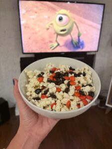 College Colors popcorn with orange and black Halloween M&Ms for a Monsters University movie night.