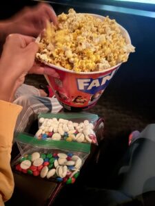 Movie theater popcorn with homemade mix-in bags of white chocolate, M&Ms and marshmallows for Casper.