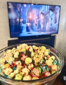 Rainbow candy-coated popcorn with chocolate chips for a Halloween movie night