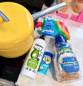 Popsmith popcorn maker with Pop Secret Jumbo kernels, avocado oil and Kernel Season’s popcorn seasonings.