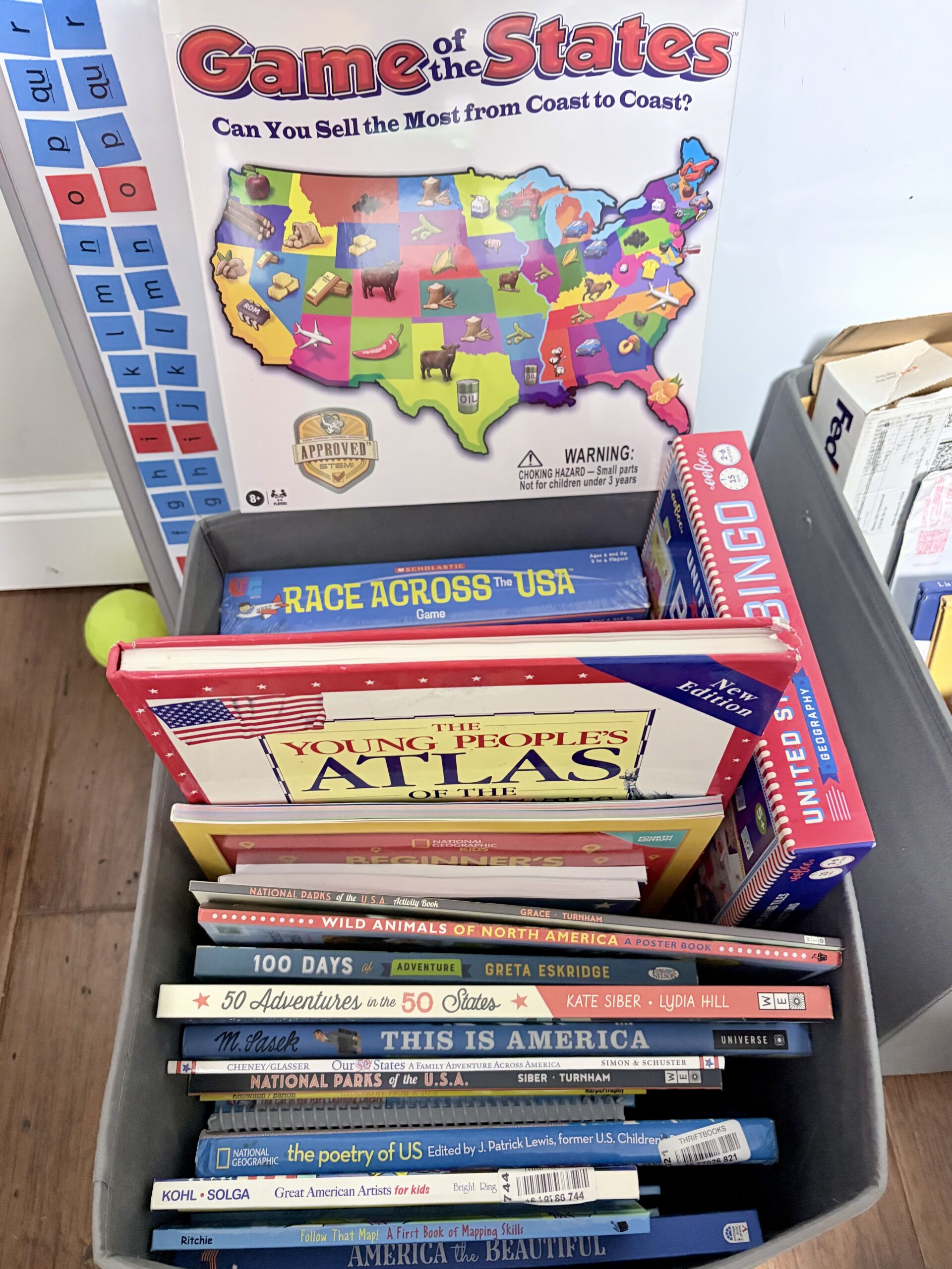 US geography homeschool curriculum collection including books, games, and atlases