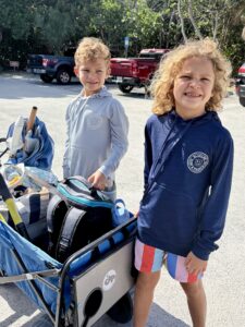 Two boys with a wagon at the entrance to Mizell-Johnson State Park in Dania Beach FL